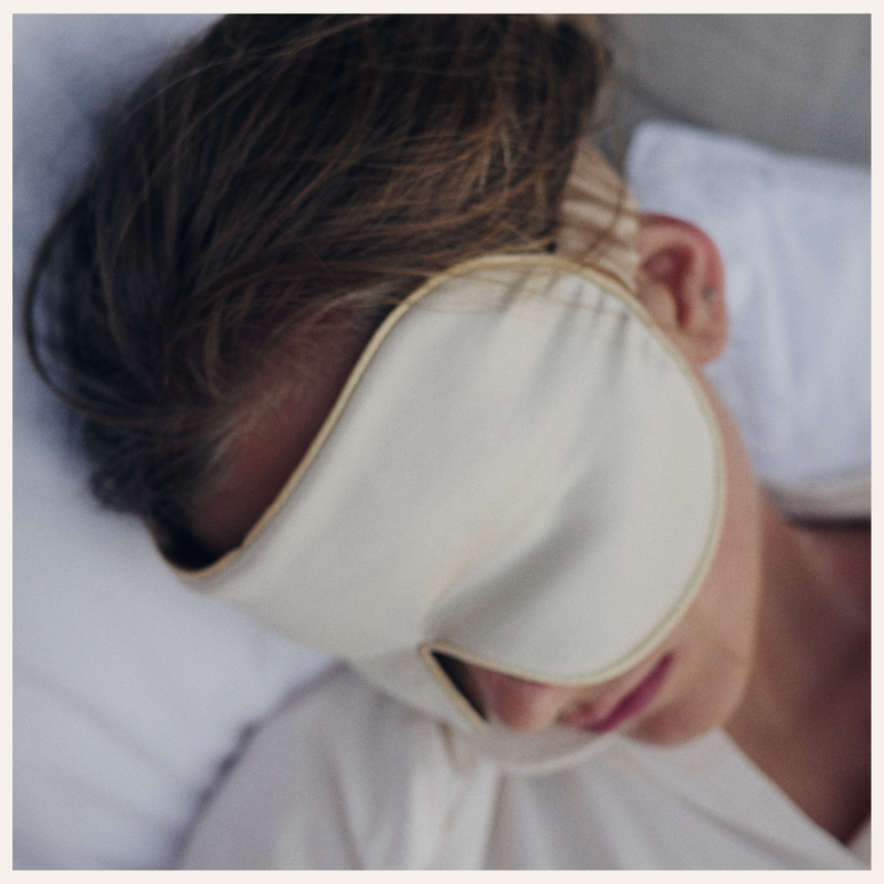 Girl with silk sleep mask in color wild chamomile 