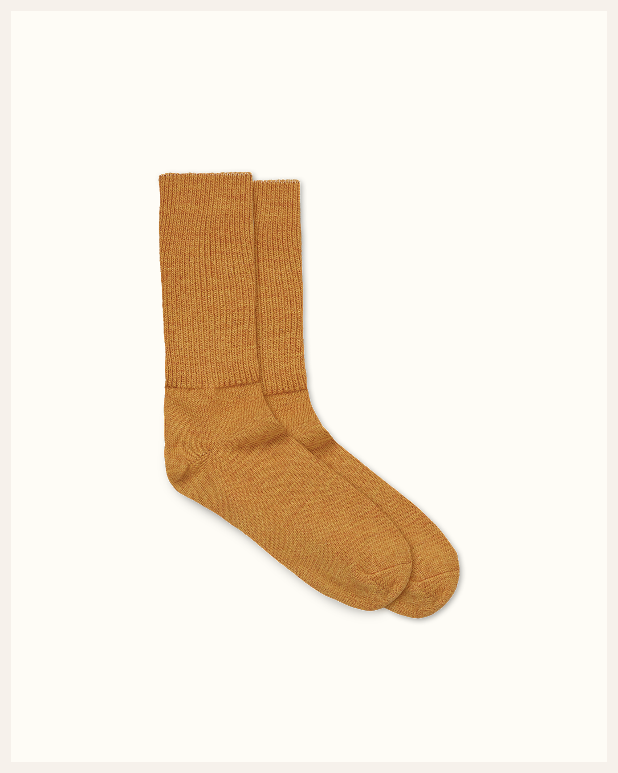 The Beauty Sleeper baby alpaca bed socks in Burnt Orange — soft, thermo-regulating socks for a soothing bedtime ritual