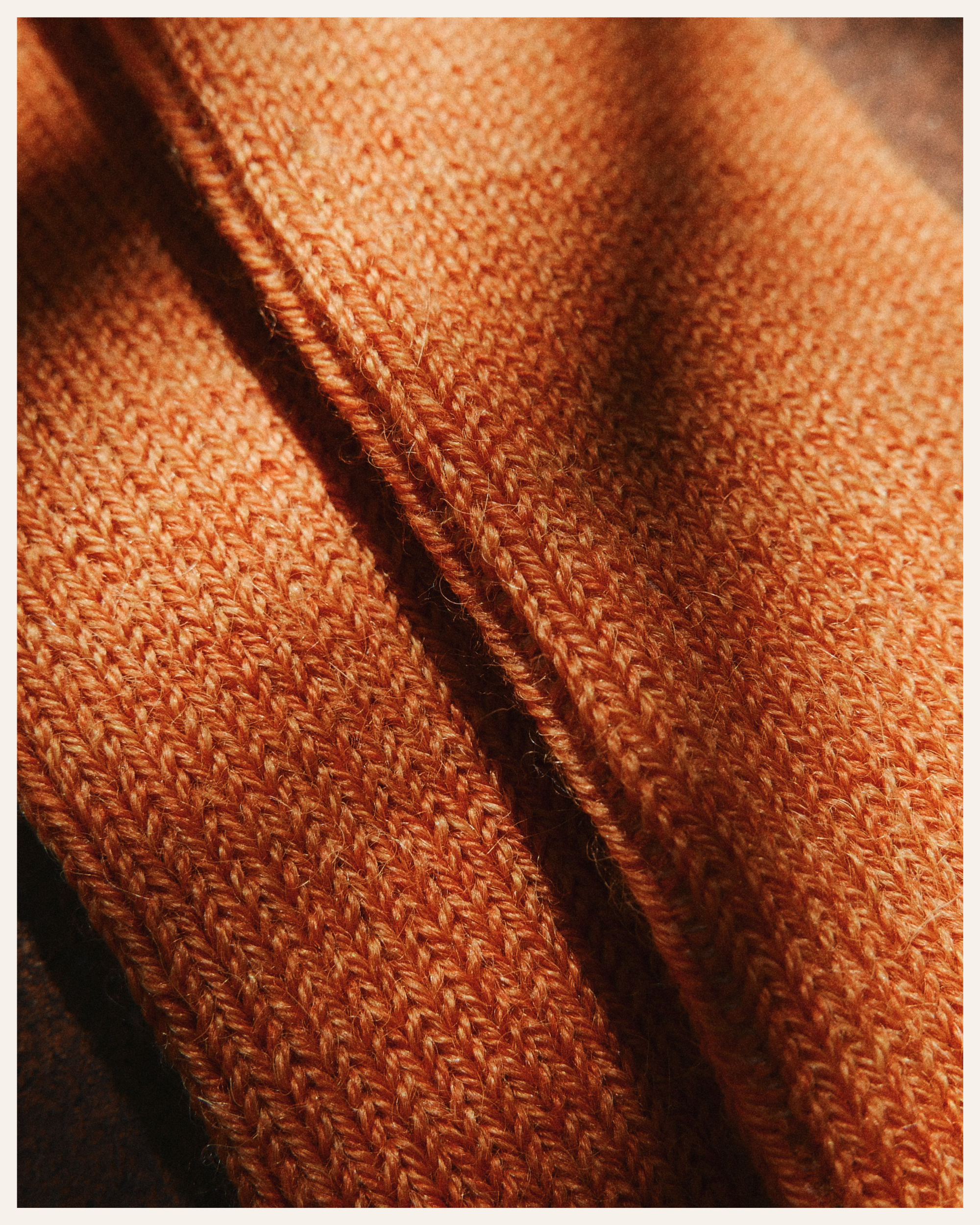 The Beauty Sleeper Burnt Orange alpaca bed socks detail — sourced from Peru, knitted in Europe