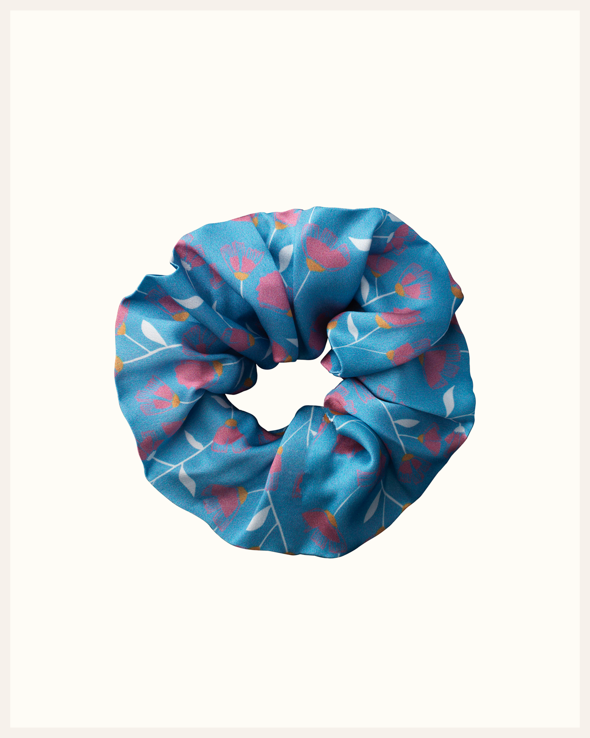 The Beauty Sleeper 100% Mulberry silk hair scrunchie in Musca Pale Blue — reduces friction and protects hair overnight