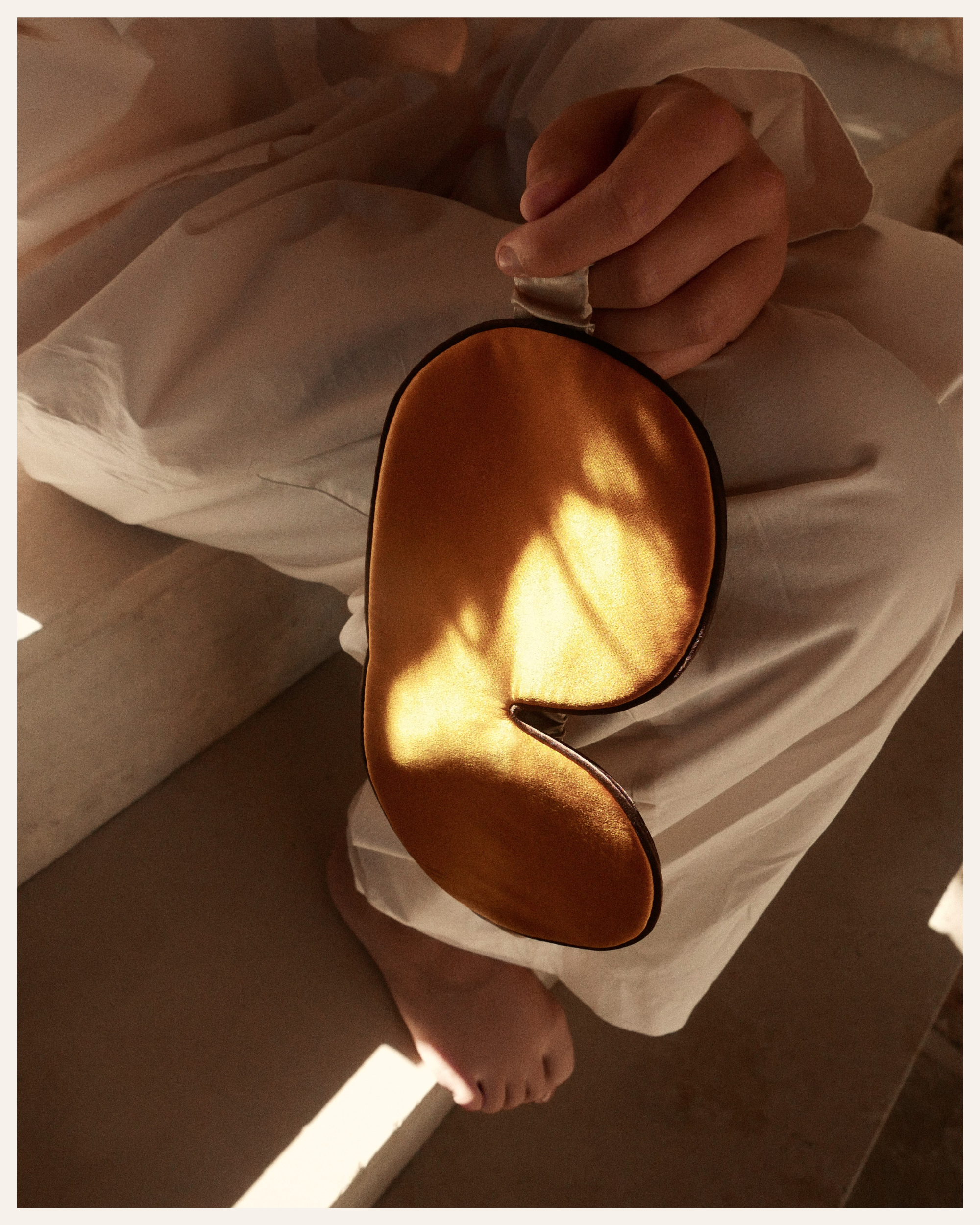 The Beauty Sleeper 100% Mulberry silk sleep mask in Golden Hour — blocks light for deep, restorative sleep