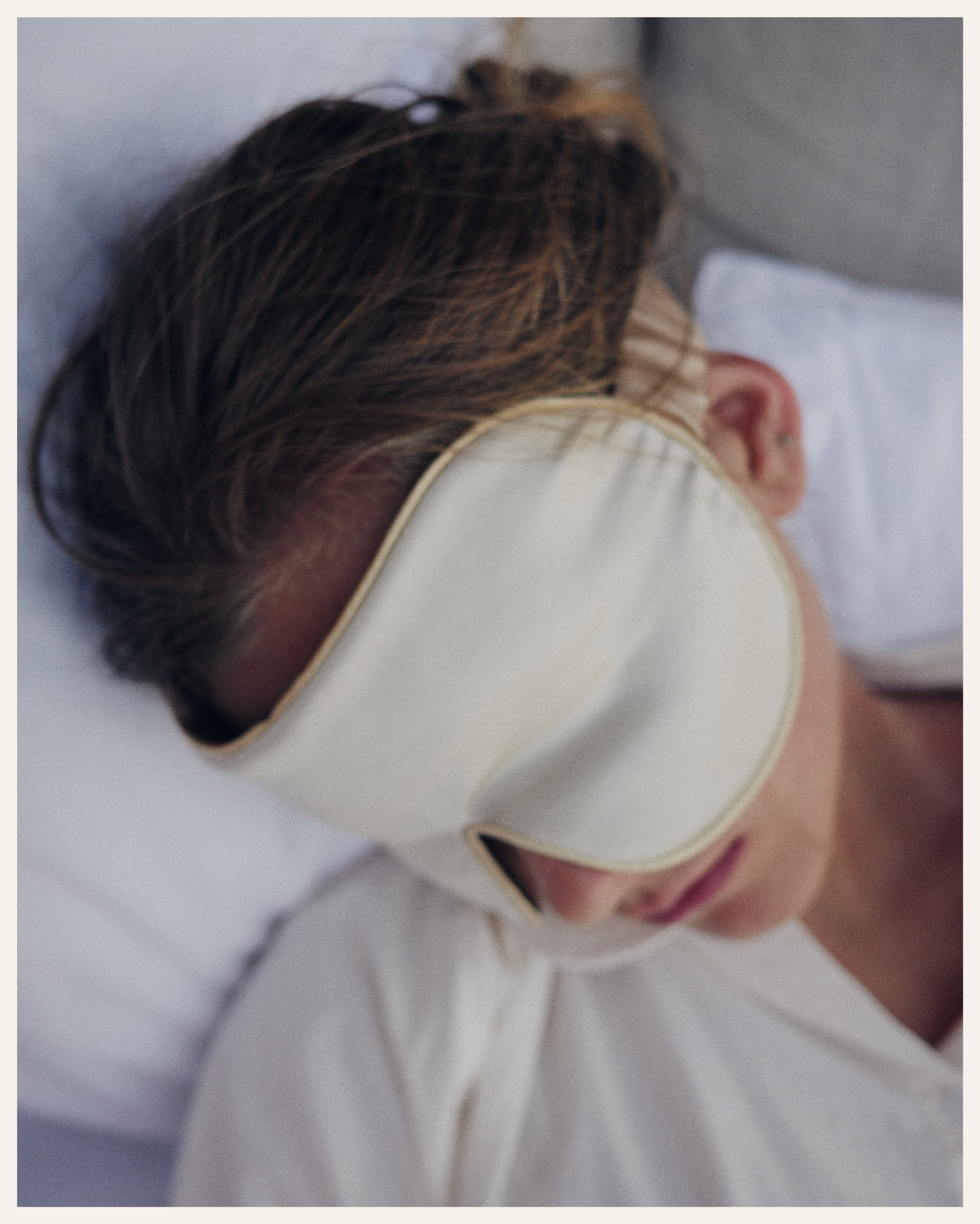 The Beauty Sleeper Wild Chamomile silk sleep mask back view — wide silk strap protects hair overnight